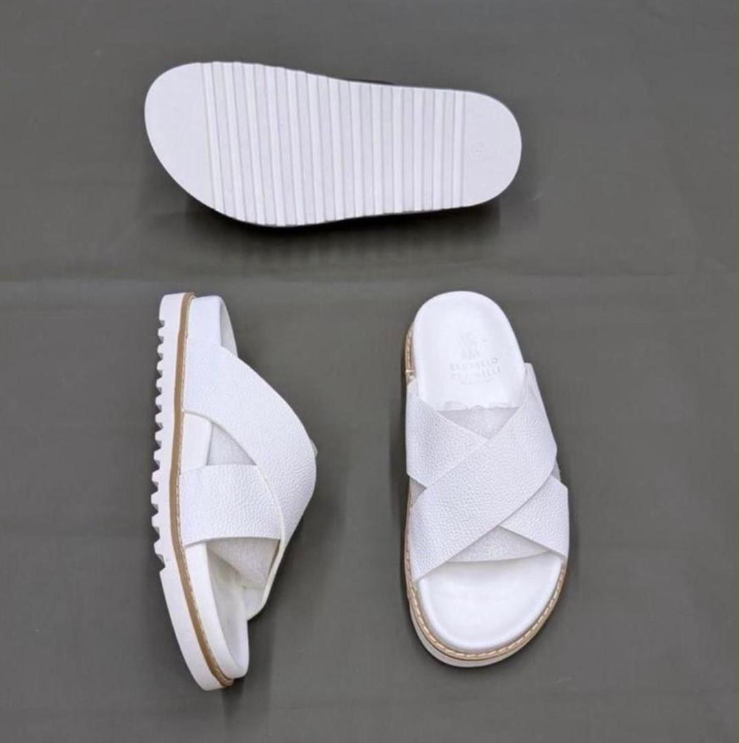 Brunello pebbled leather cross- sandals/slides