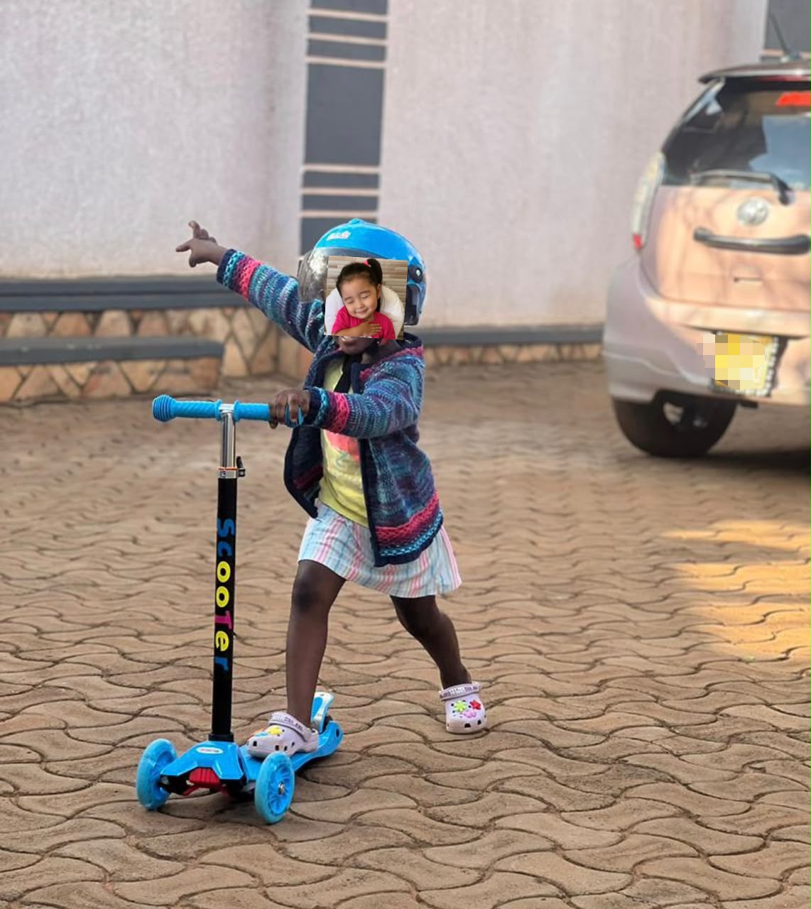 Three-wheeled kick scooter features light-up wheels and an adjustable handlebar