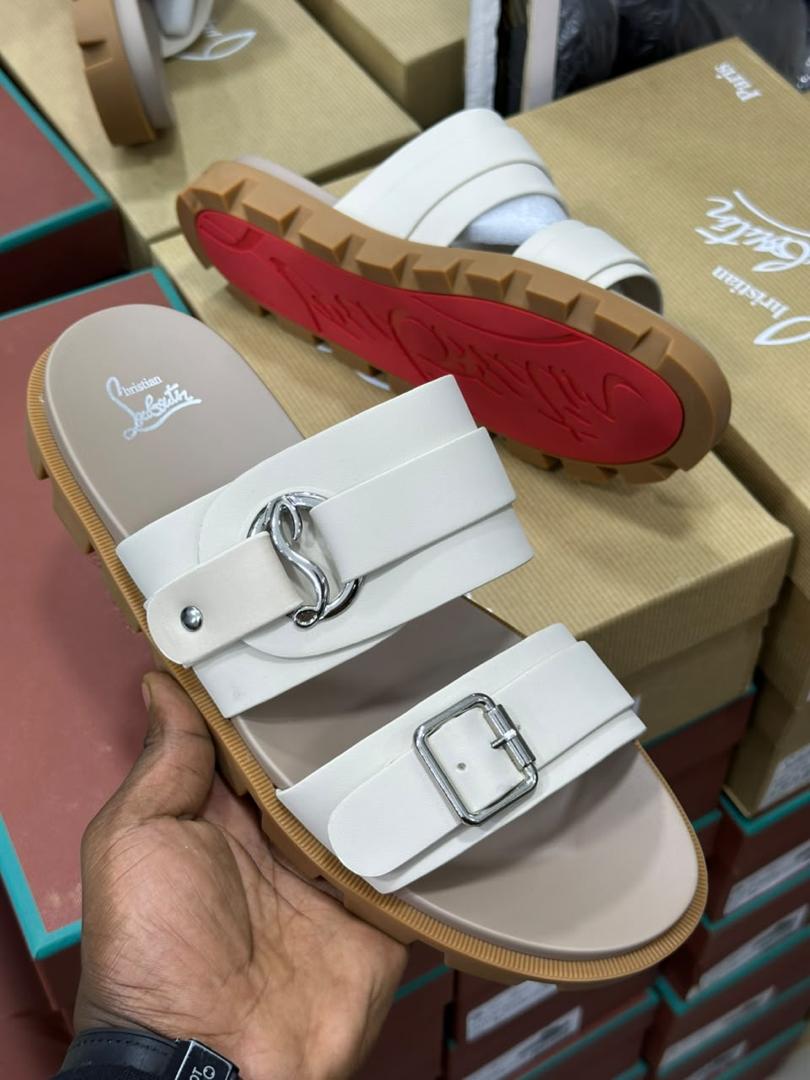 Christian Louboutin double-strap slide sandals.
