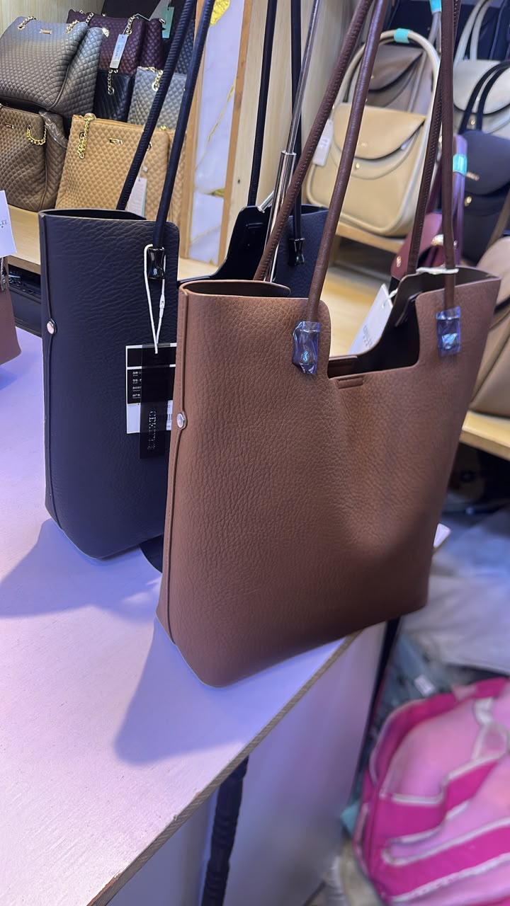 Mia bucket Pebbled leather shoulder tote bag.