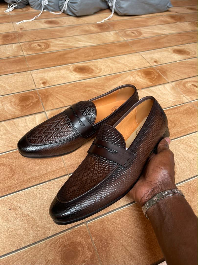 Intricate woven embossed leather penny loafers